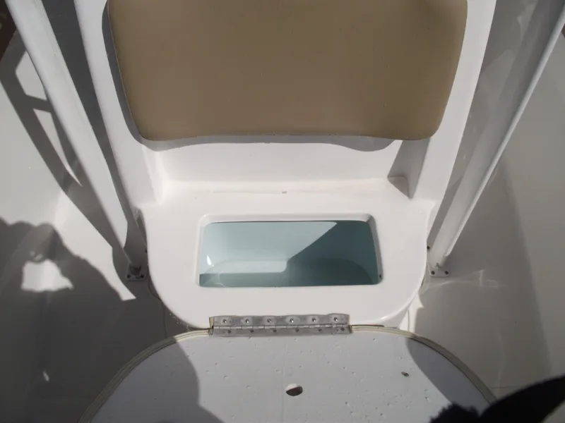 Slide: The Image of 2012 Sea Hunt Ultra 211 boat seat with storage compartment. - 14
