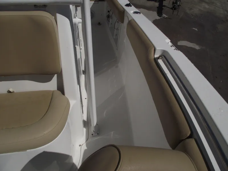 Slide: The Image of Interior view of 2012 Sea Hunt Ultra 211 boat with beige seating. - 15