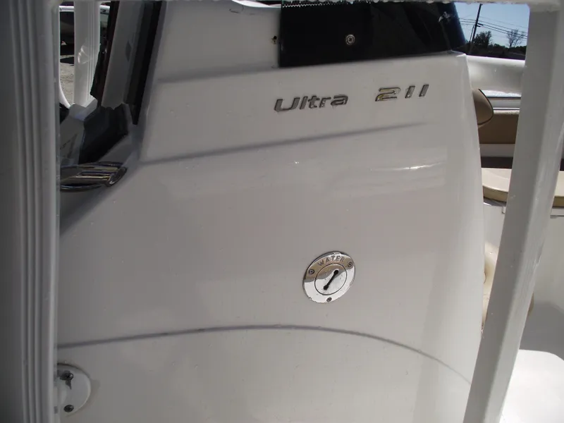 Slide: The Image of 2012 Sea Hunt Ultra 211 boat interior, showing model name and sleek design. - 17