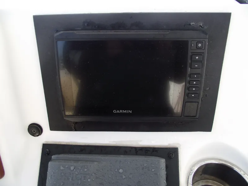 Slide: The Image of Garmin display on 2012 Sea Hunt Ultra 211 boat dashboard. - 26