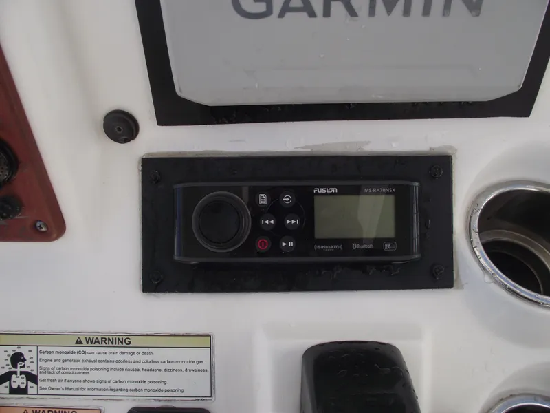 Slide: The Image of Fusion marine stereo on 2012 Sea Hunt Ultra 211 boat dashboard. - 27