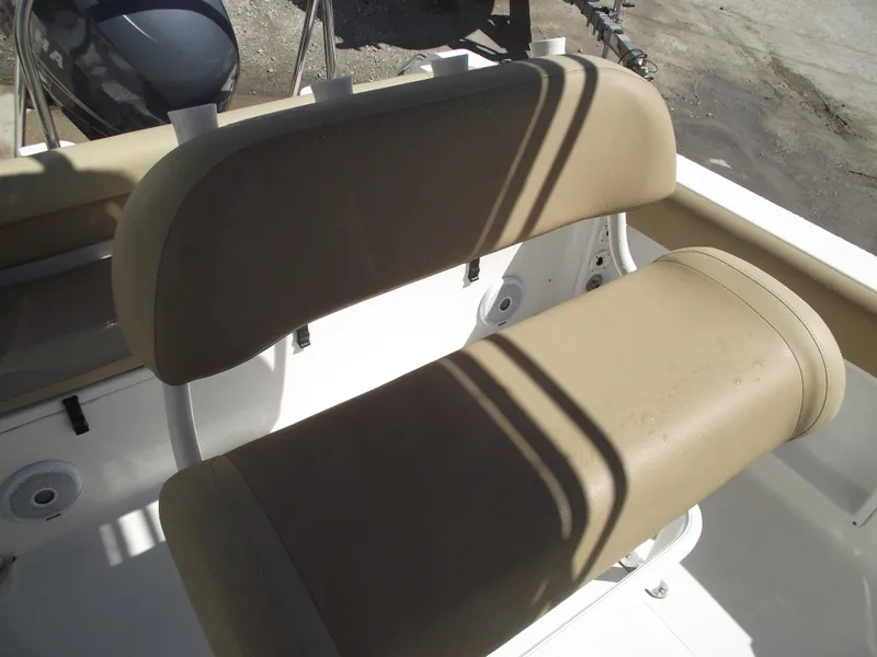 Slide: The Image of 2012 Sea Hunt Ultra 211 boat seating, beige upholstery, close-up view. - 28