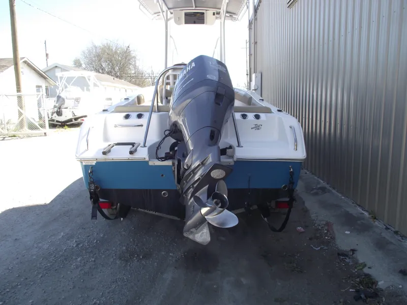 Slide: The Image of 2012 Sea Hunt Ultra 211 boat with Yamaha outboard motor, rear view. - 3