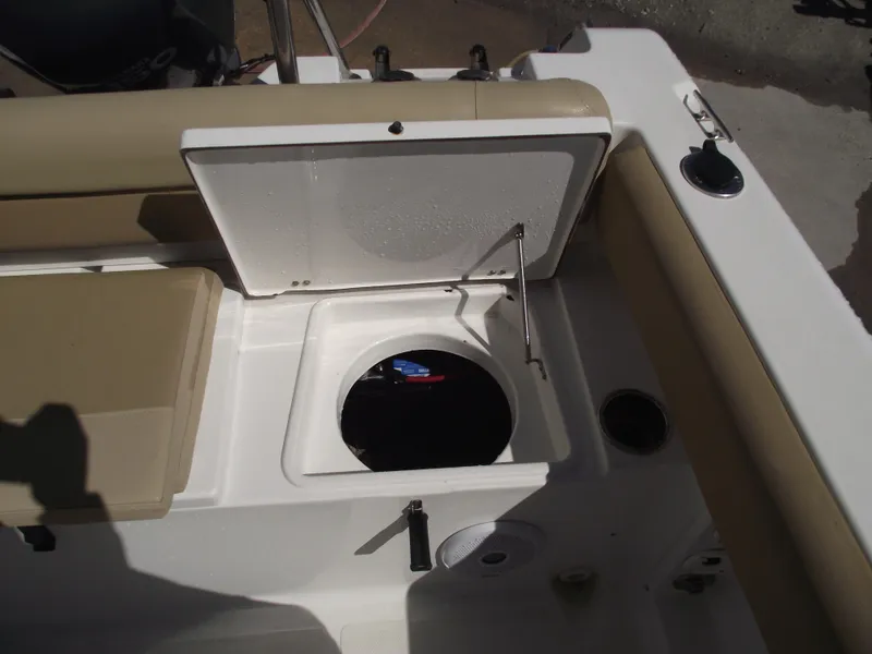 Slide: The Image of Open storage compartment on a 2012 Sea Hunt Ultra 211 boat. - 39