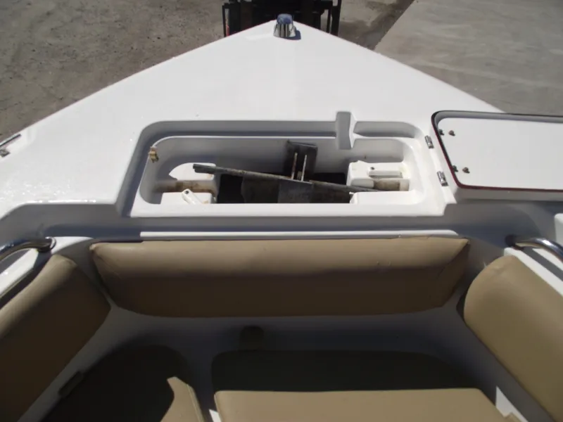 Slide: The Image of 2012 Sea Hunt Ultra 211 boat interior with storage compartment and seating. - 5