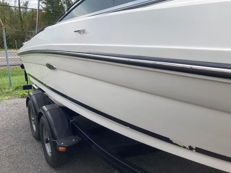 Slide: The Image of 2011 Sea Ray 205 Sport boat on trailer, side view. - 2