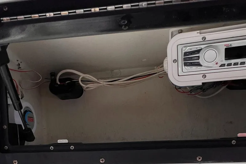 Slide: The Image of 2003 Sea Hunt Triton 202 boat interior wiring and stereo system. - 4