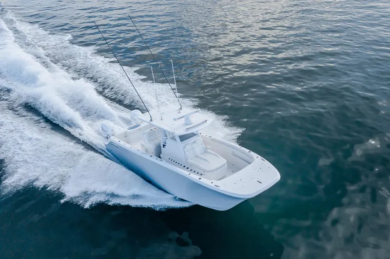 Slide: The Image of 2022 Invincible 33 Catamaran cruising on open water, showcasing sleek design and performance. - 0