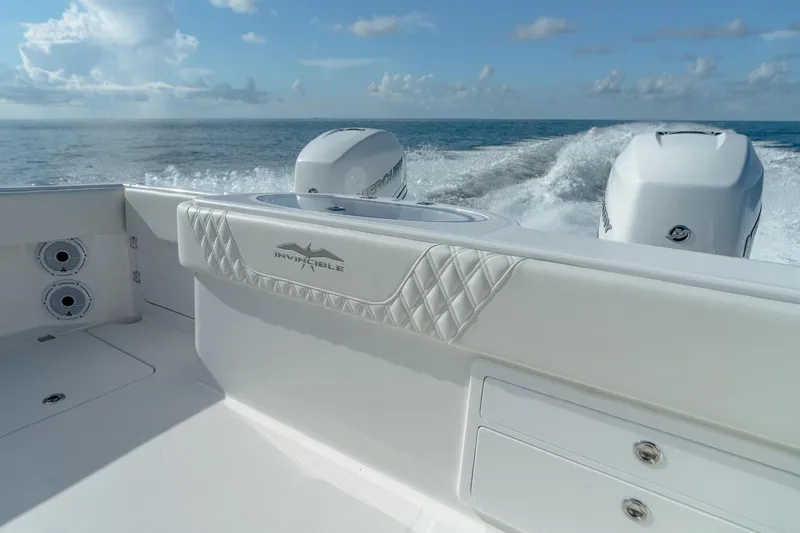 Slide: The Image of 2022 Invincible 33 Catamaran cruising on open water, showcasing powerful twin engines. - 21