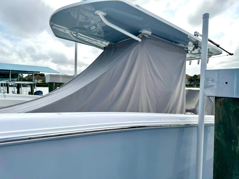 Slide: The Image of 2022 Invincible 33 Catamaran with covered deck, docked at marina. - 29