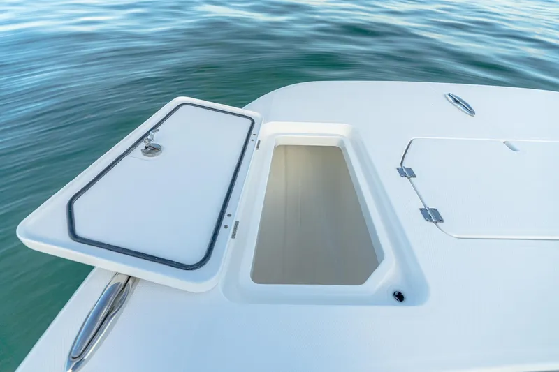 Slide: The Image of Open storage compartment on 2022 Invincible 33 Catamaran boat deck. - 8