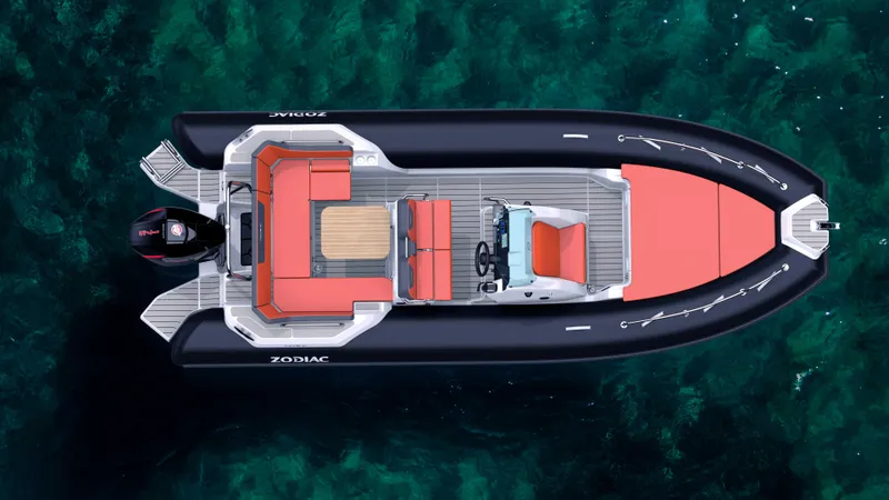 Slide: The Image of 2025 Zodiac Medline 6.8 boat on clear water, top view, red and black design. - 4