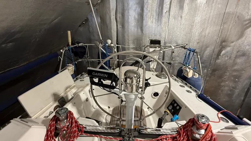 Slide: The Image of 1989 J Boats J/40 sailboat cockpit with Garmin navigation system and red ropes. - 10