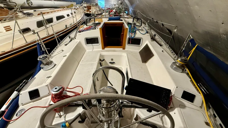 Slide: The Image of 1989 J Boats J/40 sailboat cockpit with steering wheel and winches. - 13