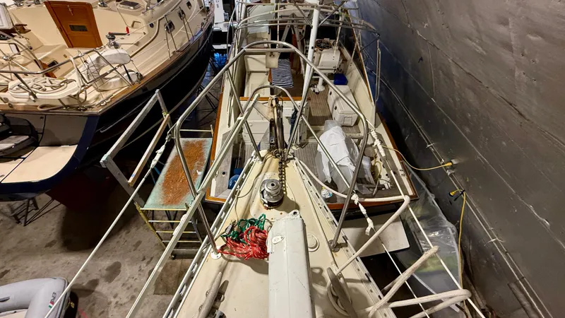 Slide: The Image of 1989 J Boats J/40 sailboat in storage, viewed from above, showcasing deck and rigging. - 16
