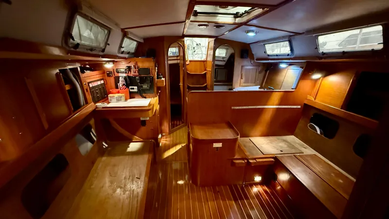 Slide: The Image of 1989 J Boats J/40 interior with wooden finish and ample lighting. - 29