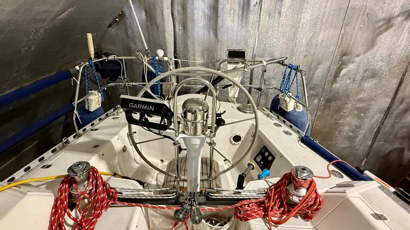 Slide: The Image of 1989 J Boats J/40 sailboat cockpit with Garmin navigation system and red ropes. - 9