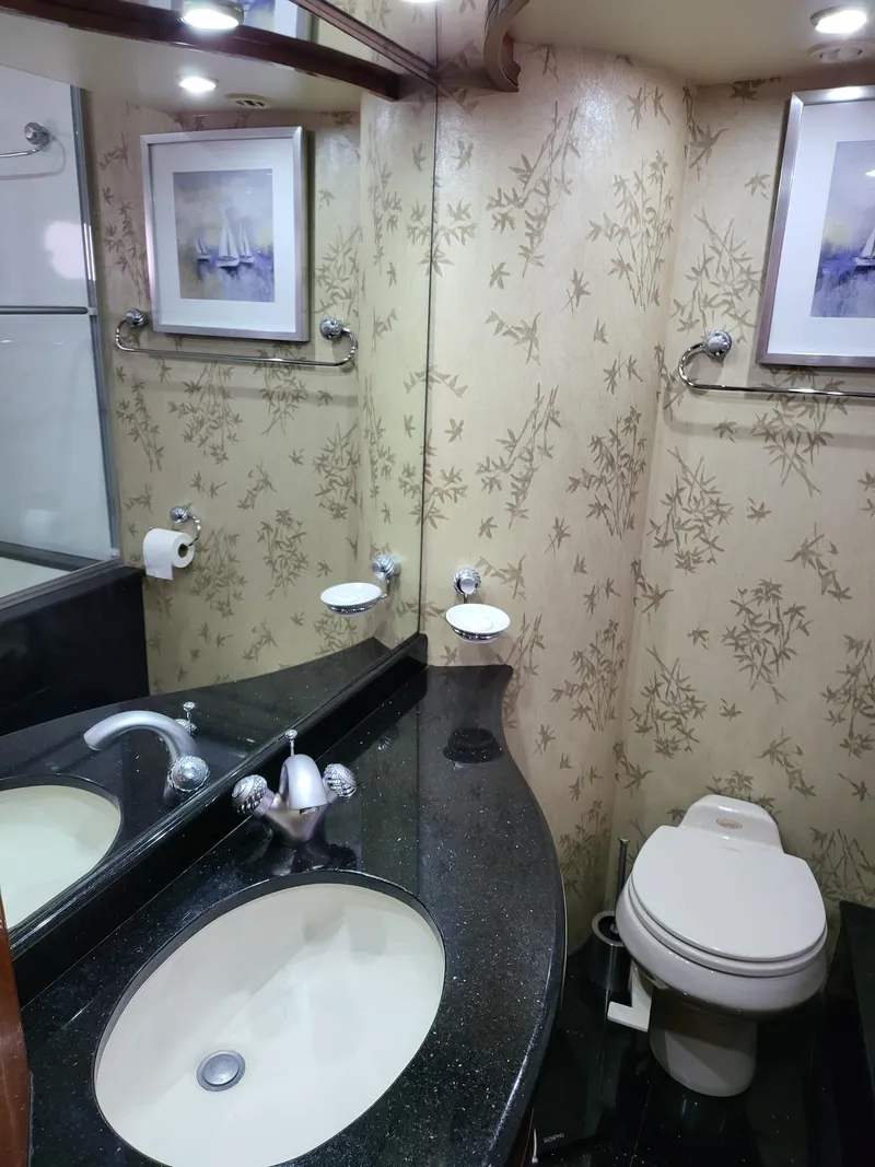 Slide: The Image of Luxurious bathroom in 2004 Marquis 59 yacht with elegant wallpaper and modern fixtures. - 45
