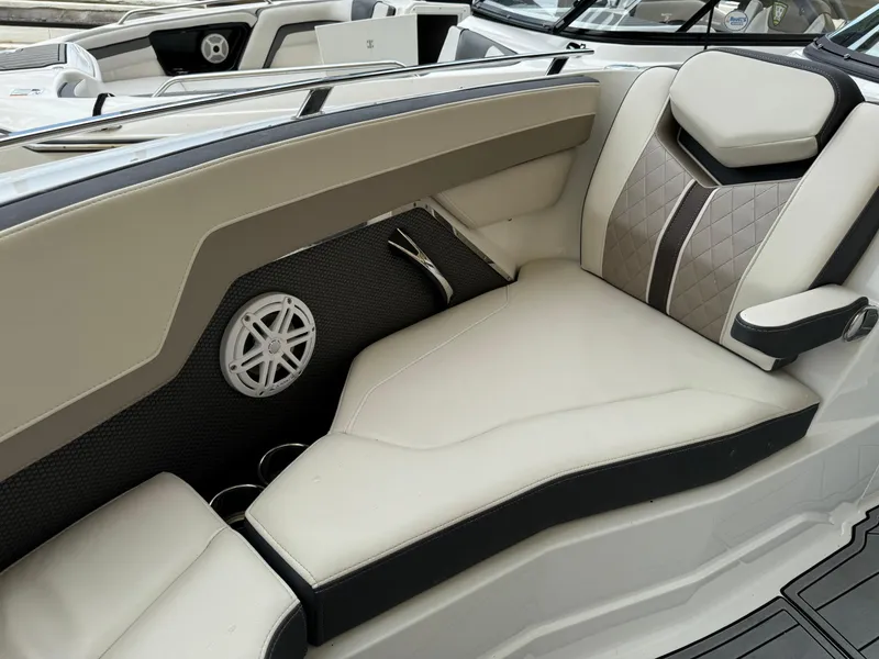Slide: The Image of 2022 Monterey 278 Super Sport boat interior with luxurious seating and speaker detail. - 15