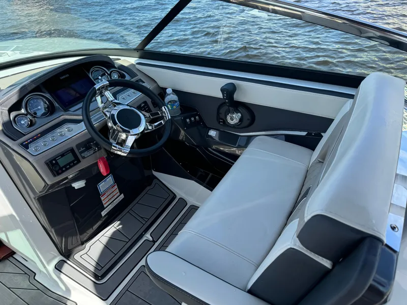 Slide: The Image of 2022 Monterey 278 Super Sport boat cockpit with modern steering and controls. - 20