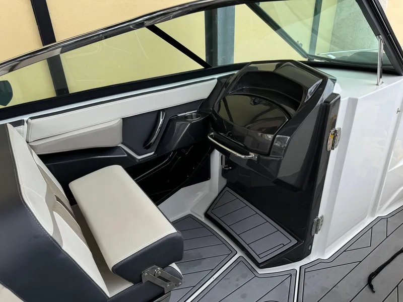 Slide: The Image of 2022 Monterey 278 Super Sport boat interior with modern dashboard and seating. - 22