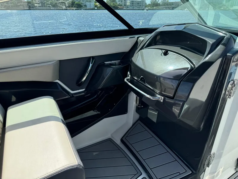 Slide: The Image of 2022 Monterey 278 Super Sport boat interior with sleek design and modern dashboard. - 23