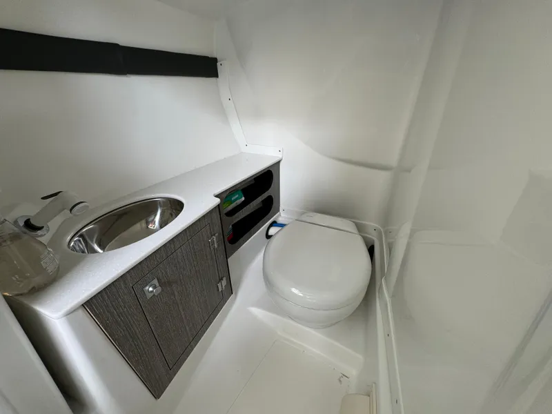 Slide: The Image of 2022 Monterey 278 Super Sport boat bathroom with sink and toilet. - 24