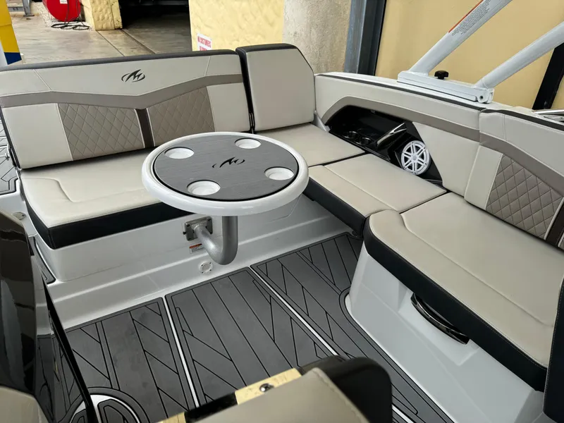 Slide: The Image of 2022 Monterey 278 Super Sport boat interior with seating and table. - 27