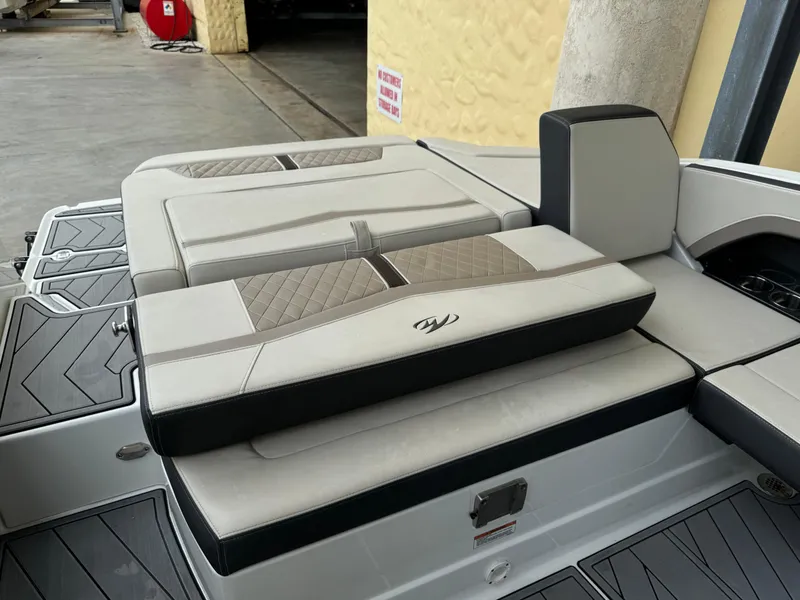 Slide: The Image of 2022 Monterey 278 Super Sport boat with cushioned seating and stylish design. - 30