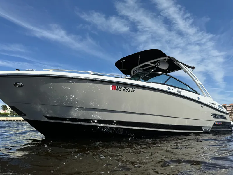 Slide: The Image of 2022 Monterey 278 Super Sport boat on water under blue sky. - 4