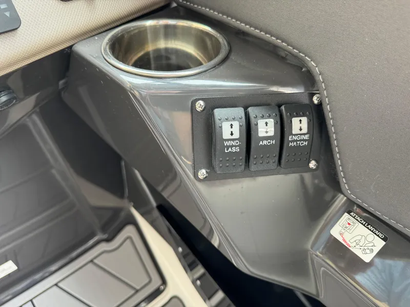 Slide: The Image of Control panel of 2022 Monterey 278 Super Sport boat with cup holder and switches. - 40