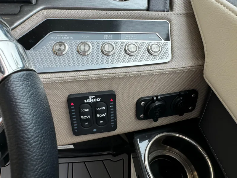 Slide: The Image of Control panel of a 2022 Monterey 278 Super Sport boat with switches and cup holder. - 41