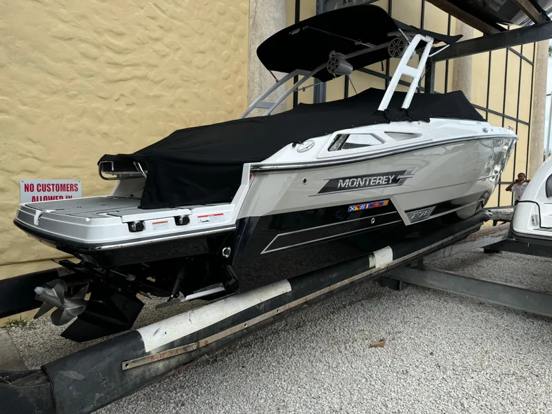 Slide: The Image of 2022 Monterey 278 Super Sport boat on trailer, covered and parked outdoors. - 7
