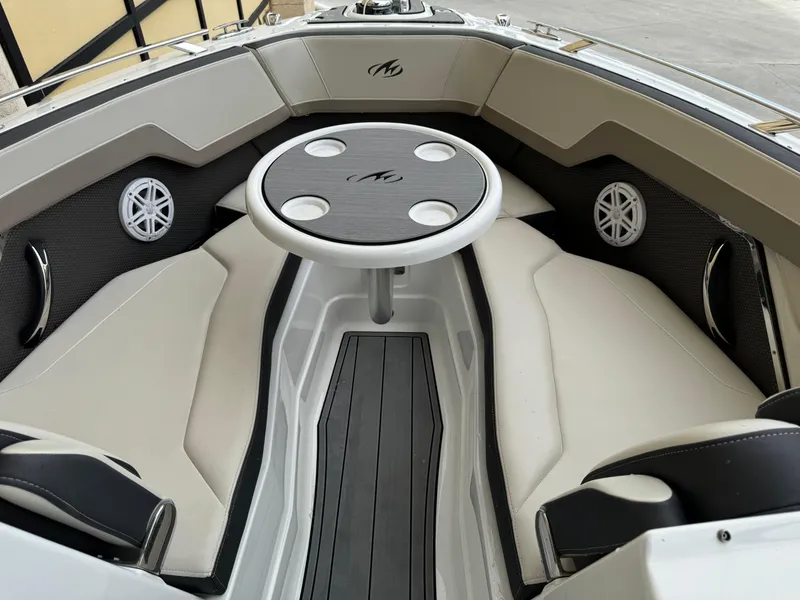 Slide: The Image of 2022 Monterey 278 Super Sport boat interior with seating and table. - 9