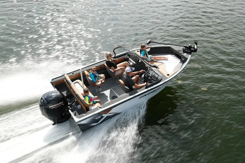 Slide: The Image of 2024 Starweld Victory 18 DC boat cruising on water with passengers enjoying the ride. - 2