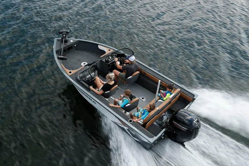 Slide: The Image of 2024 Starweld Victory 18 DC boat cruising on water with passengers enjoying the ride. - 3