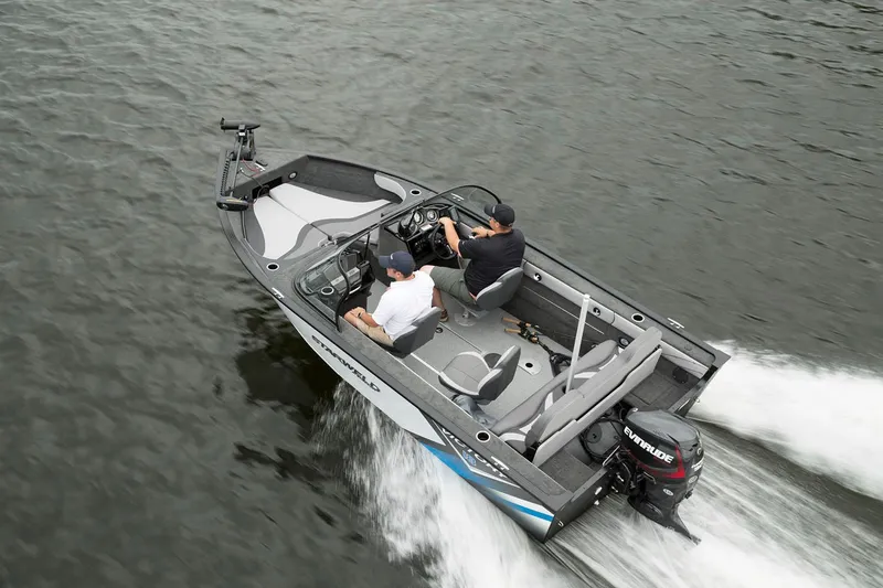 Slide: The Image of 2024 Starweld Victory 18 DC boat cruising on water with two passengers. - 9