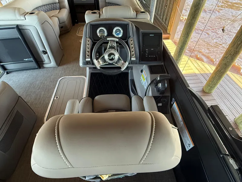 Slide: The Image of 2022 Barletta Lusso 23U boat interior with steering console and luxurious seating. - 16