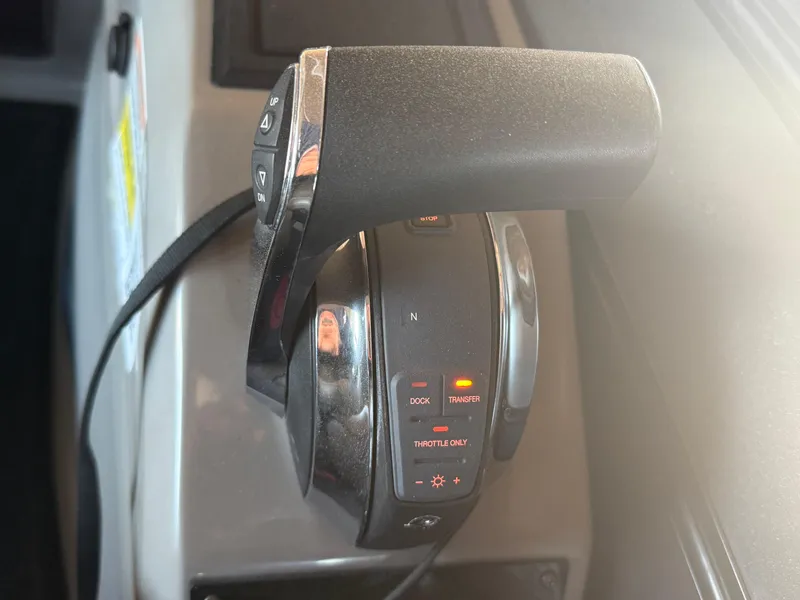 Slide: The Image of Throttle control of 2022 Barletta Lusso 23U pontoon boat, featuring illuminated buttons. - 19