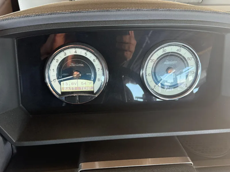 Slide: The Image of Dashboard gauges of a 2022 Barletta Lusso 23U boat, showing battery voltage and temperature. - 21