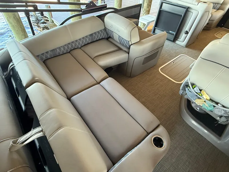 Slide: The Image of 2022 Barletta Lusso 23U pontoon boat interior with luxurious seating and modern design. - 22