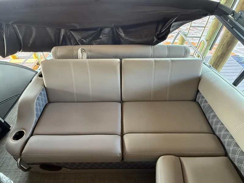 Slide: The Image of 2022 Barletta Lusso 23U boat seating with gray upholstery and cup holder. - 23