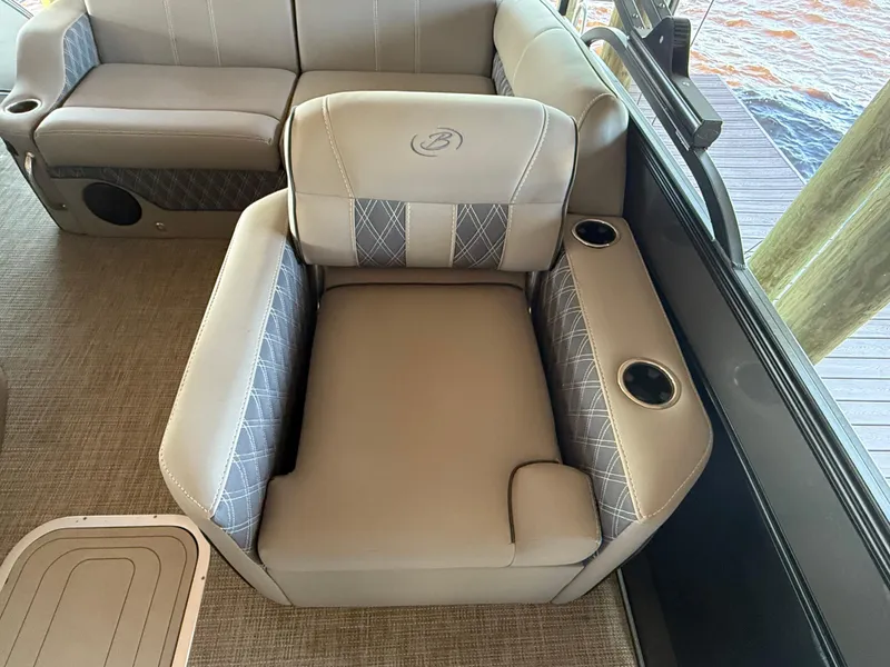 Slide: The Image of 2022 Barletta Lusso 23U boat seating with cup holders and elegant upholstery design. - 26