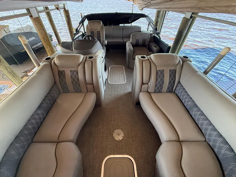 Slide: The Image of 2022 Barletta Lusso 23U pontoon boat interior with luxurious seating and elegant design. - 29