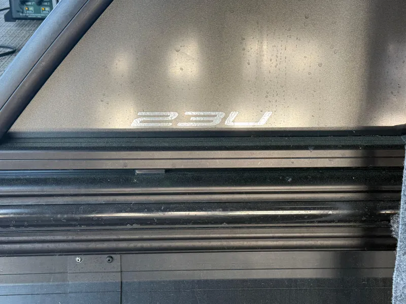 Slide: The Image of 2022 Barletta Lusso 23U boat detail with model emblem. - 32