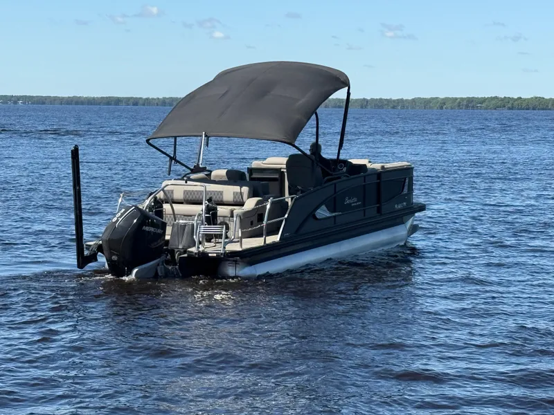 Slide: The Image of 2022 Barletta Lusso 23U pontoon boat on a calm lake. - 5