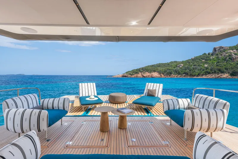 Slide: The Image of Luxurious Lagoon Eighty 2 yacht deck with stylish seating, overlooking serene blue waters, 2025 model. - 14