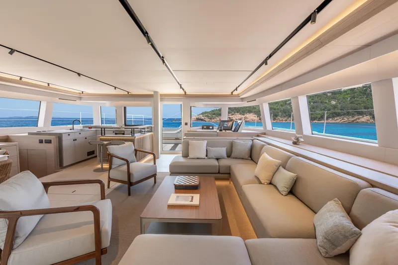 Slide: The Image of Helm of 2025 Lagoon Eighty 2 yacht with ocean view and modern controls. - 19