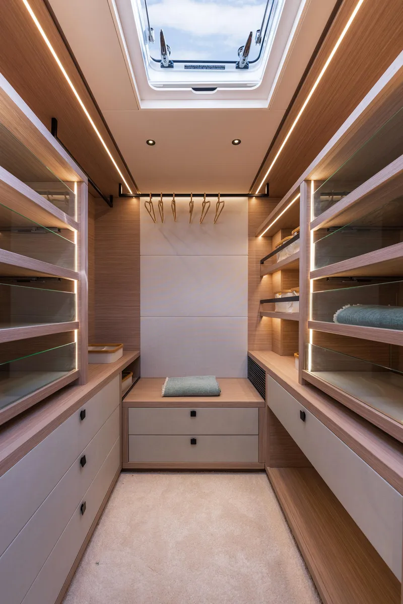 Slide: The Image of Luxurious interior of 2025 Lagoon Eighty 2 yacht with modern desk and shelving. - 27