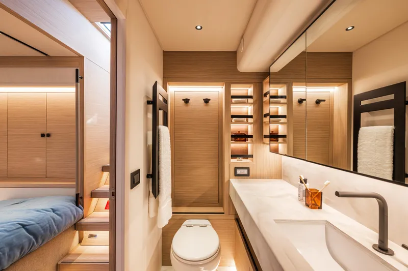 Slide: The Image of Luxurious bedroom interior of 2025 Lagoon Eighty 2 yacht with modern design and scenic window view. - 34